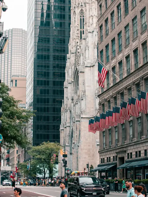 St. Patrick's Cathedral on Fifth Avenue with black SUVs on the street